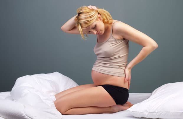 Боли в спине во время беременности
